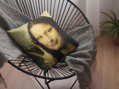 A Mona Lisa meme placed on a modern basket-style chair.