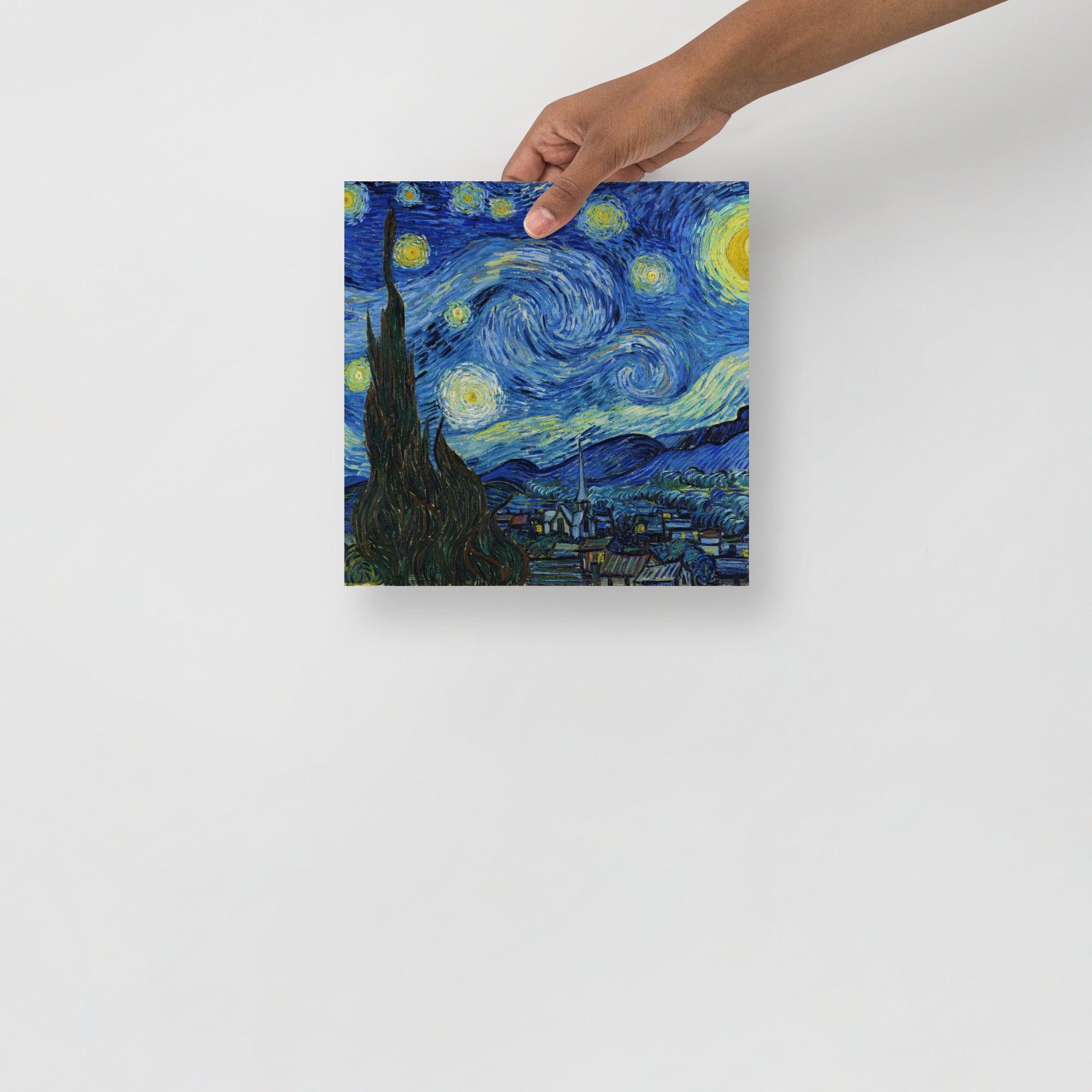 A The Starry Night by Vincent van Gogh poster on a plain backdrop in size 10x10”.