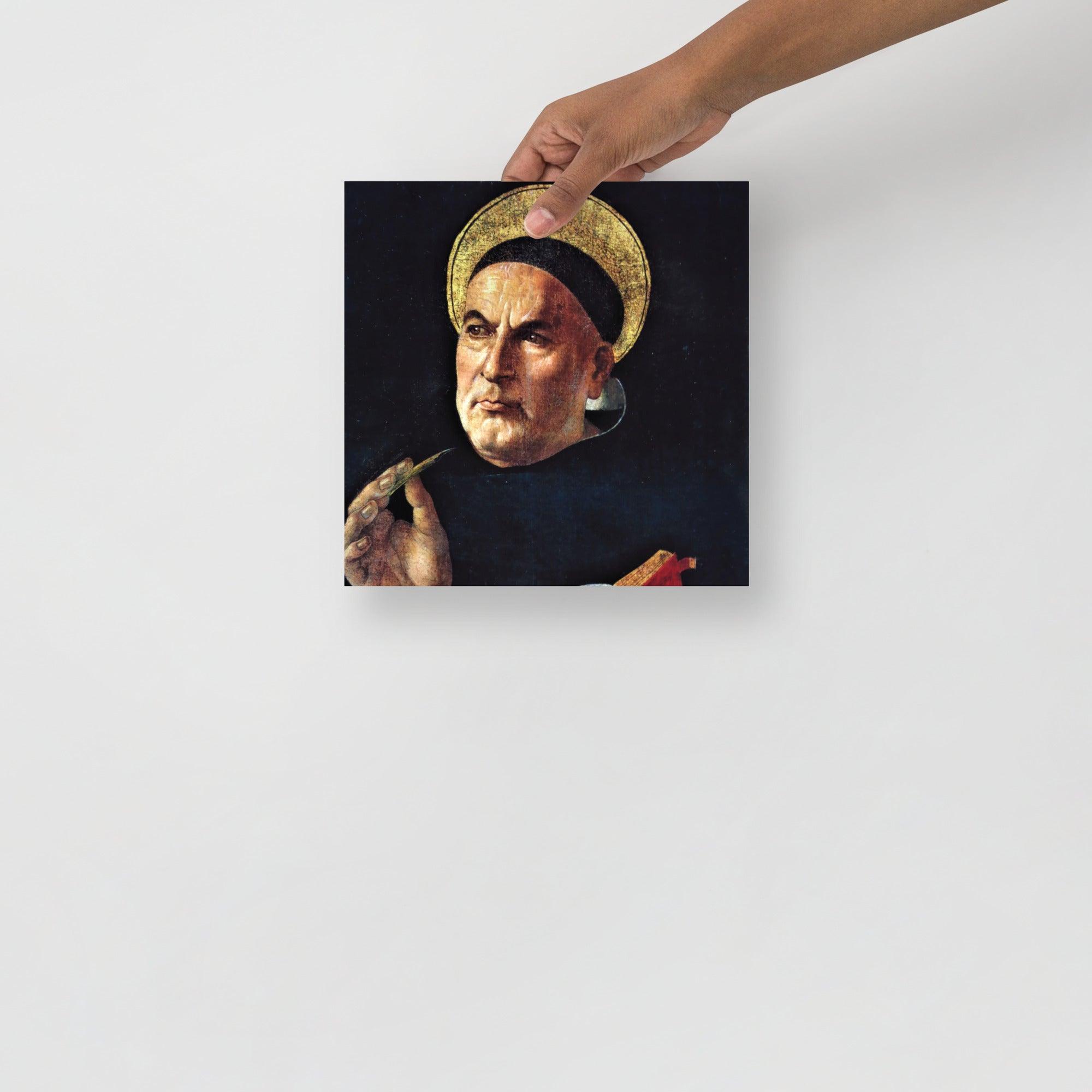 A St. Thomas Aquinas by Sandro Botticelli poster on a plain backdrop in size 10x10”.
