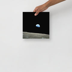 An Earthrise Apollo 8 poster on a plain backdrop in size 10x10”.