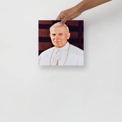A Pope John Paul II poster on a plain backdrop in size 10x10”.