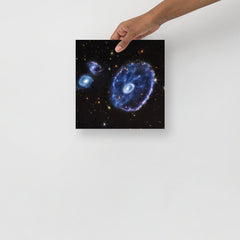 A Cartwheel Galaxy by James Webb Space Telescope poster on a plain backdrop in size 10x10”.