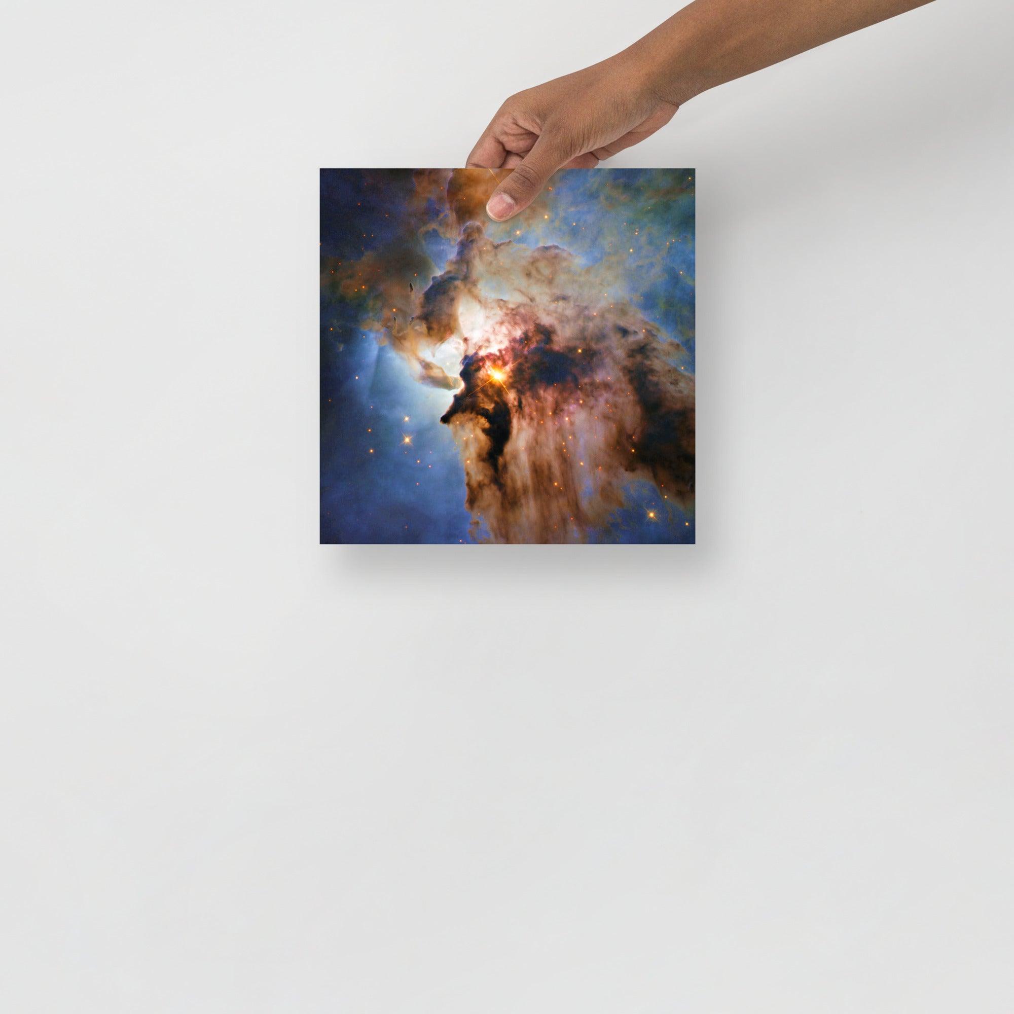 A Lagoon Nebula by Hubble Space Telescope poster on a plain backdrop in size 10x10”.
