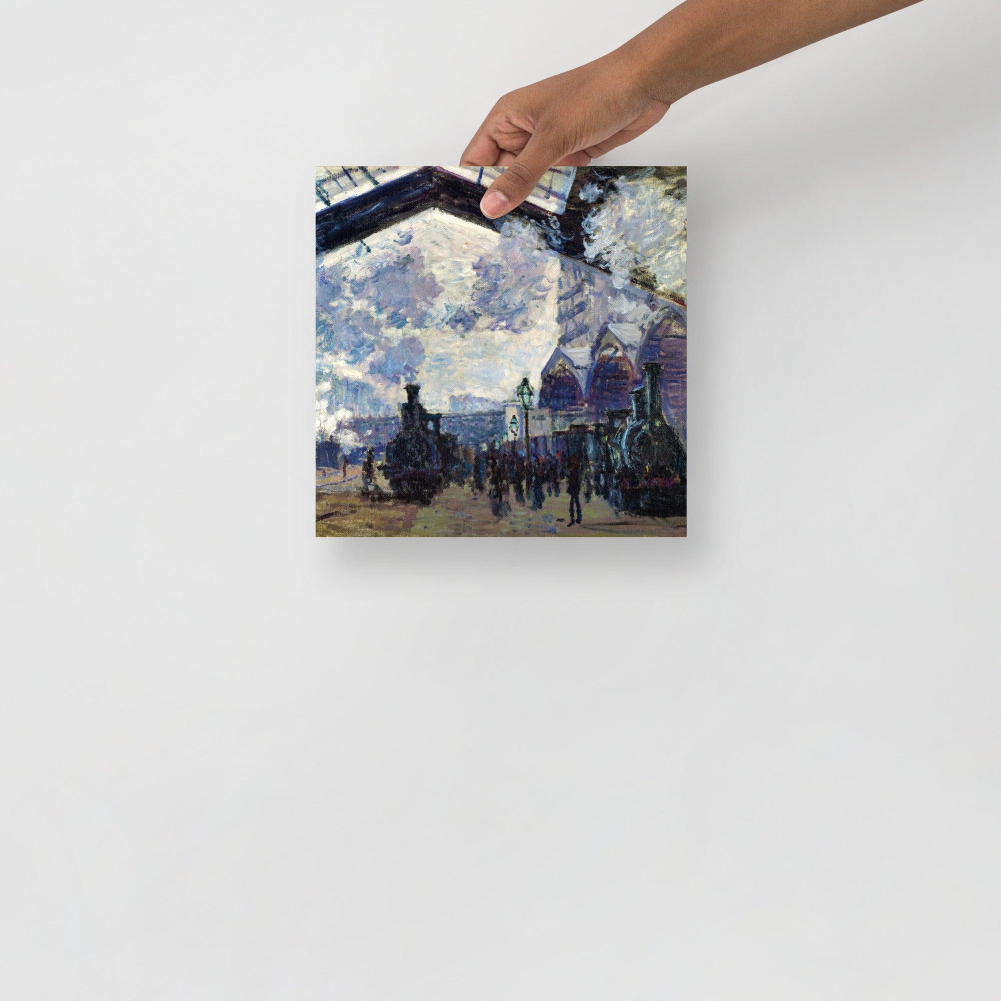 The Gare St-Lazare by Claude Monet  poster on a plain backdrop in size 10x10”.