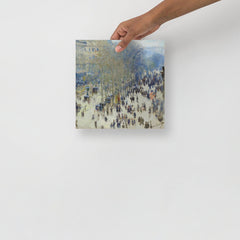 A Boulevard des Capucines by Claude Monet poster on a plain backdrop in size 10x10”.