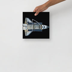 A Space Shuttle Atlantis poster on a plain backdrop in size 10x10”.