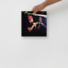 A Rosie the Riveter poster on a plain backdrop in size 10x10”.