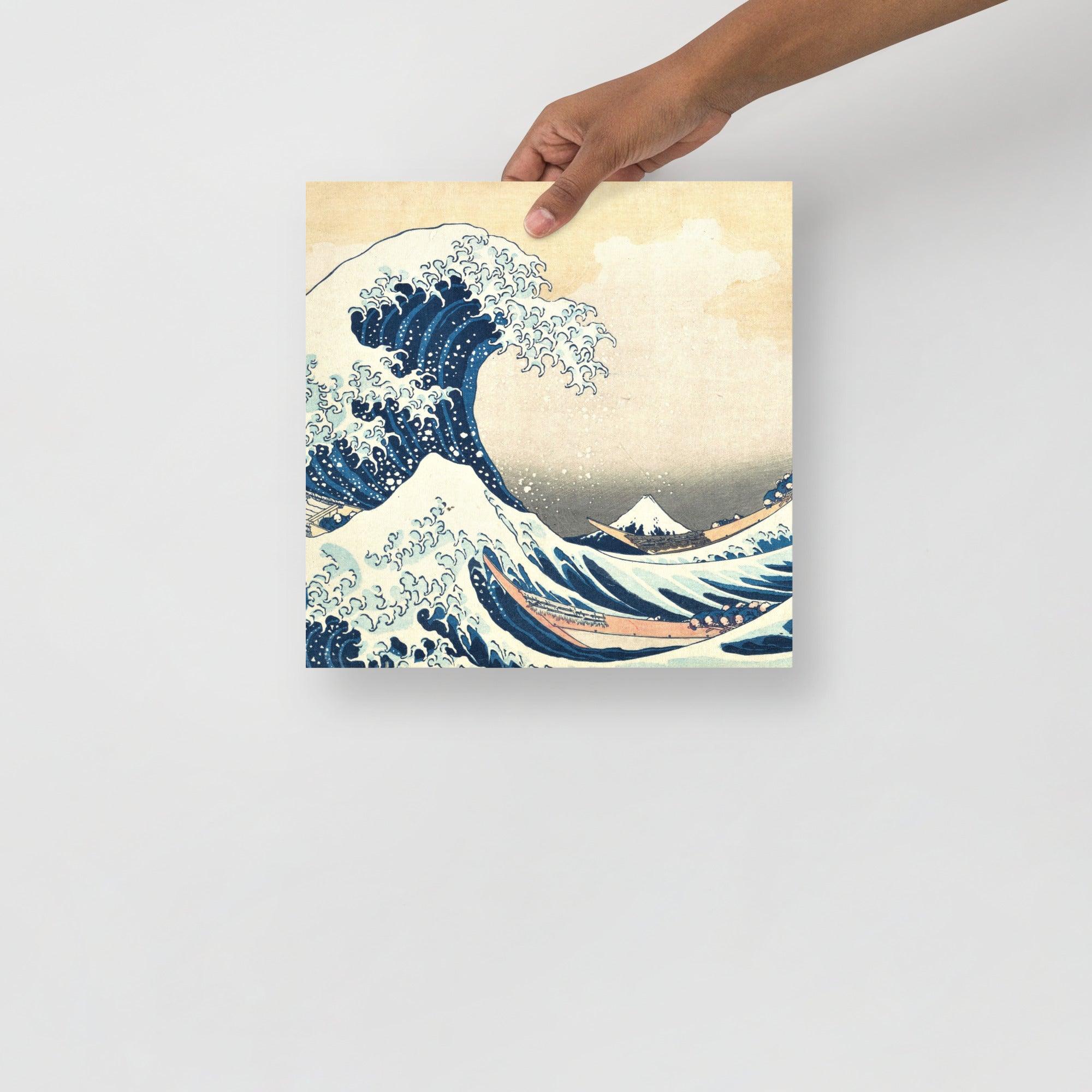 The Great Wave off Kanagawa by Hokusai poster on a plain backdrop in size 12x12”.