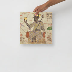 A Mansa Musa poster on a plain backdrop in size 12x12”.