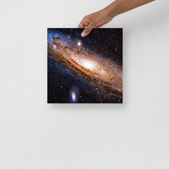 An Andromeda Galaxy poster on a plain backdrop in size 12x12”.