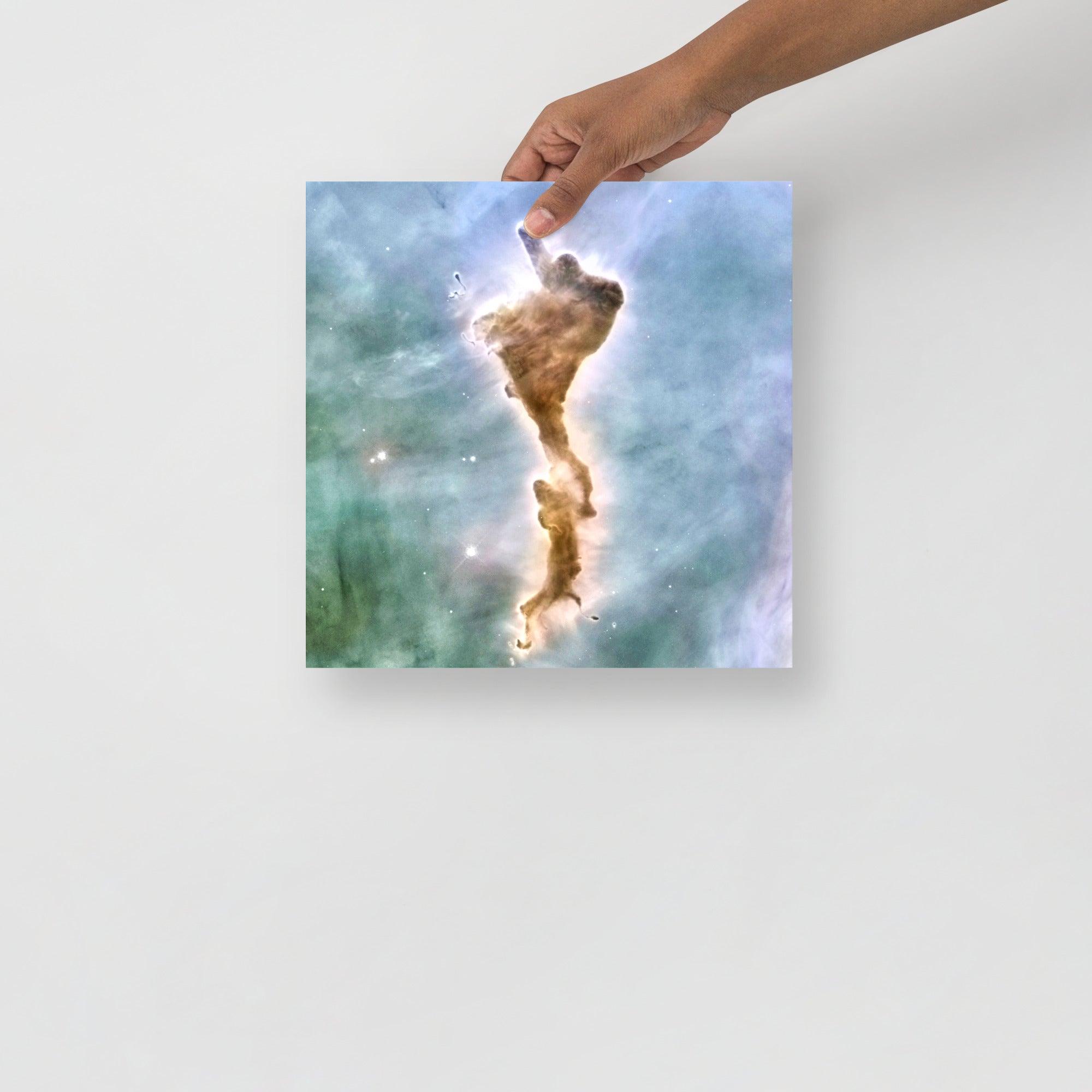 A Finger of God (Carina Nebula) poster on a plain backdrop in size 12x12”.