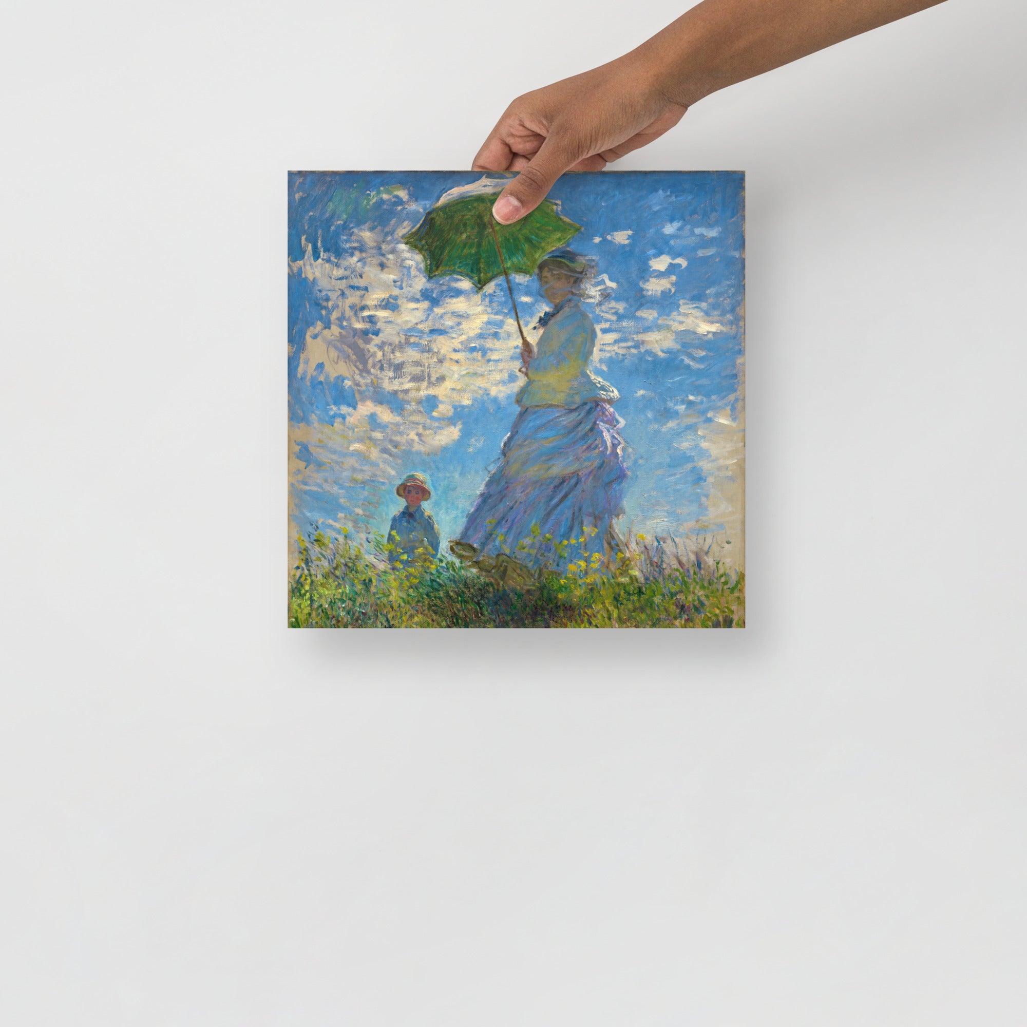 A Madame Monet and Her Son by Claude Monet poster on a plain backdrop in size 12x12”.