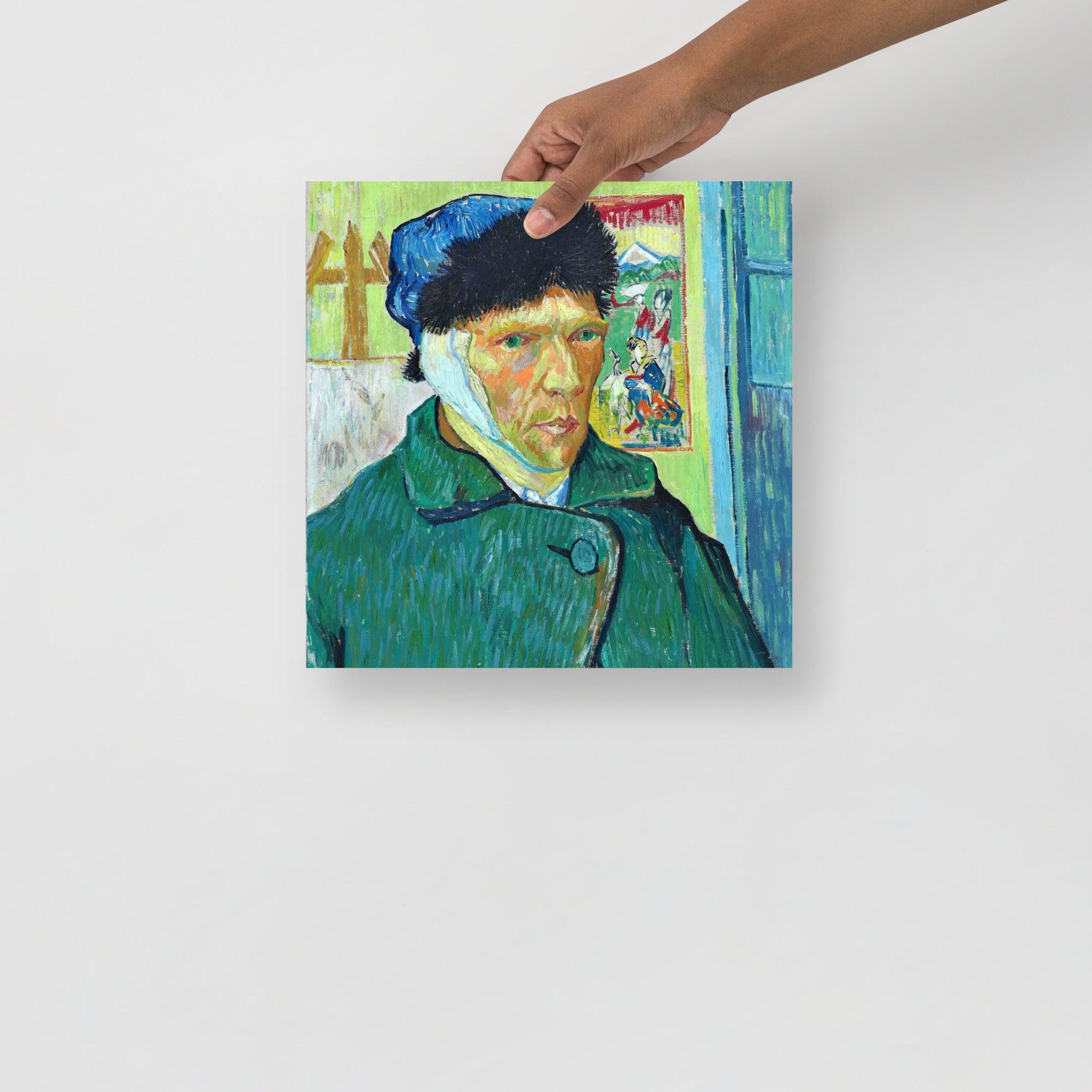 A Self Portrait With Bandaged Ear by Vincent Van Gogh poster on a plain backdrop in size 12x12”.