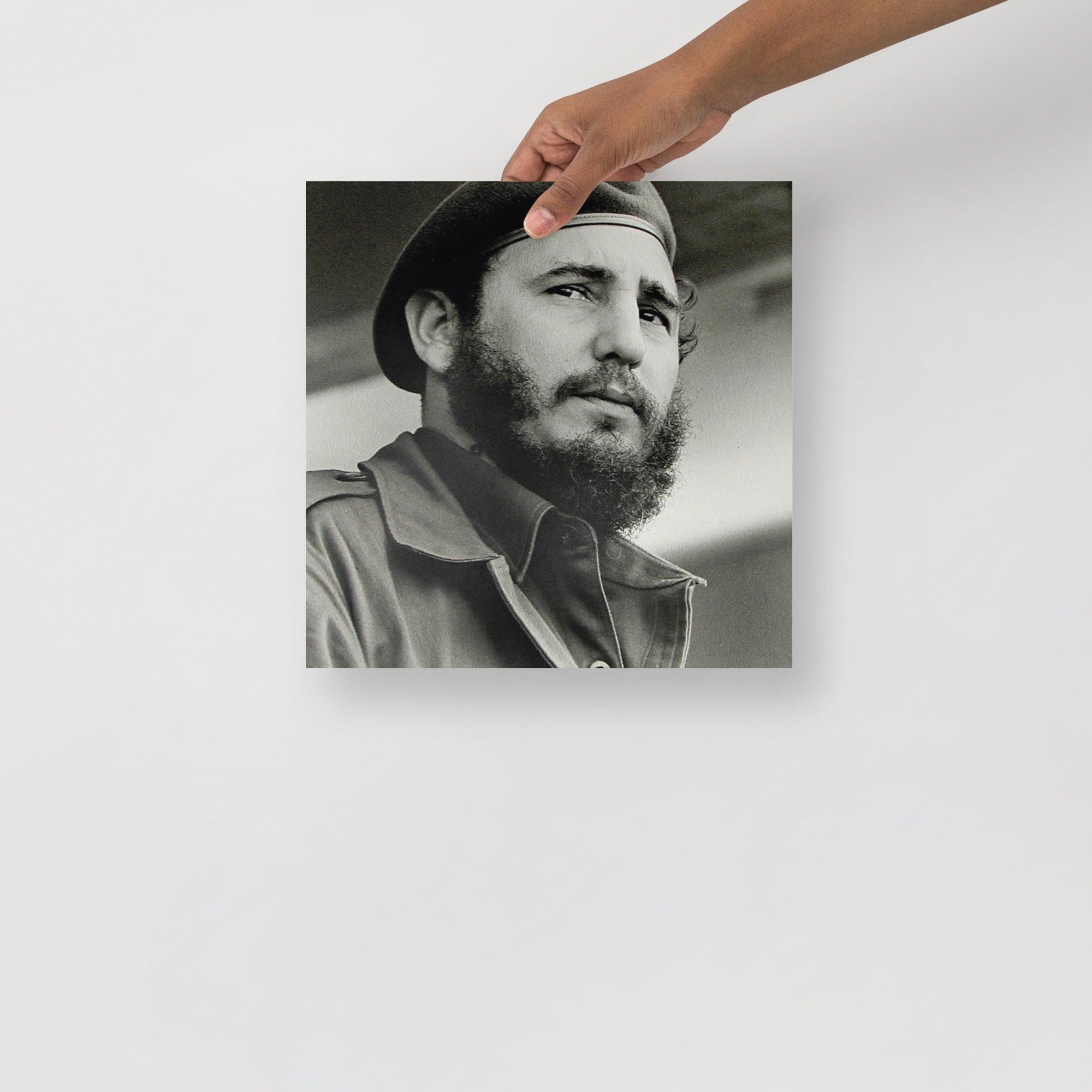 A Fidel Castro poster on a plain backdrop in size 12x12”.
