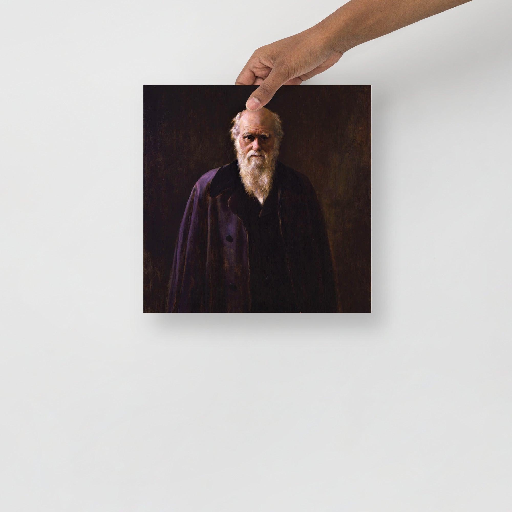 A Charles Darwin By John Collier poster on a plain backdrop in size 12x12”.