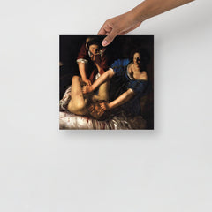 A Judith beheading Holofernes by Artemisia Gentileschi poster on a plain backdrop in size 12x12”.