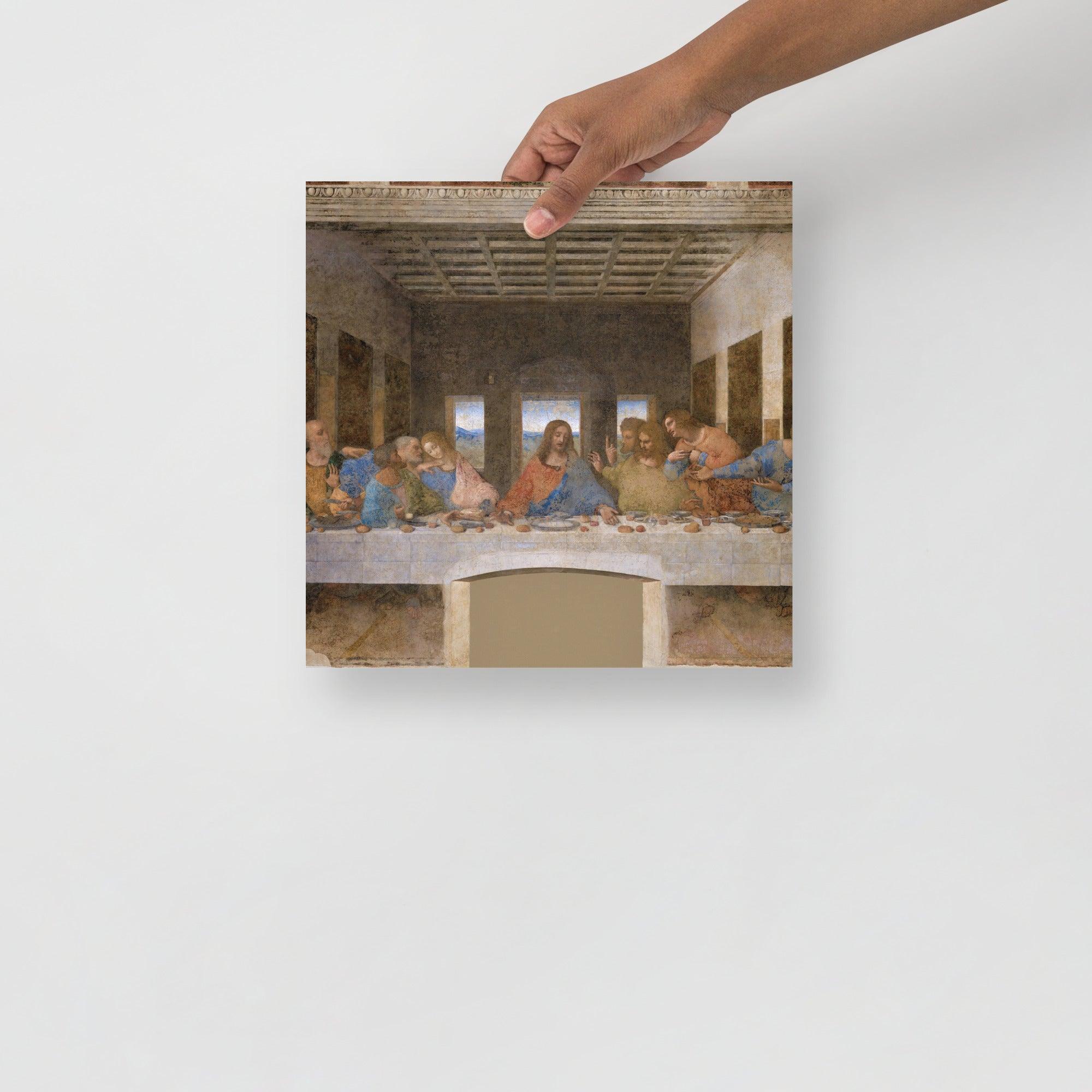 The Last Supper by Leonardo Da Vinci poster on a plain backdrop in size 12x12”.