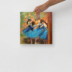 A Dancers in Blue by Edgar Degas poster on a plain backdrop in size 12x12”.