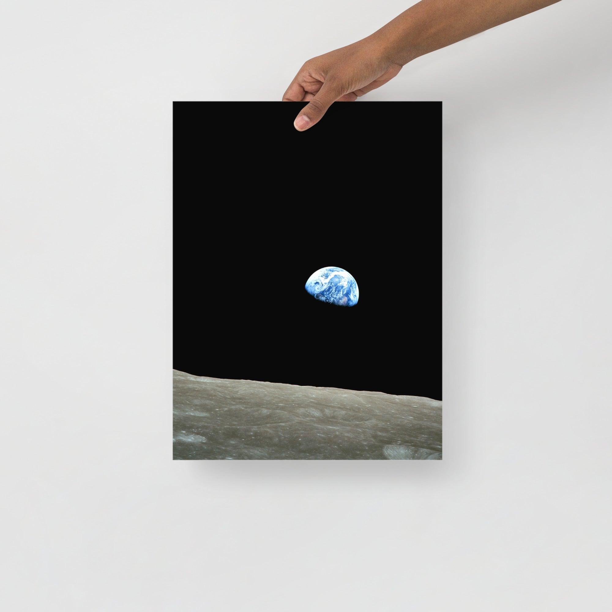 An Earthrise Apollo 8 poster on a plain backdrop in size 12x16”.