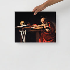 A Saint Jerome Writing by Caravaggio poster on a plain backdrop in size 12x16”.