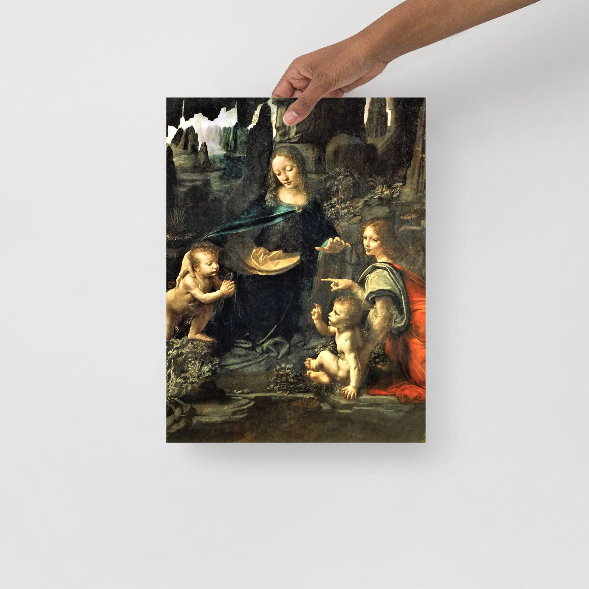 A Virgin of the Rocks by Leonardo Da Vinci  poster on a plain backdrop in size 12x16”.