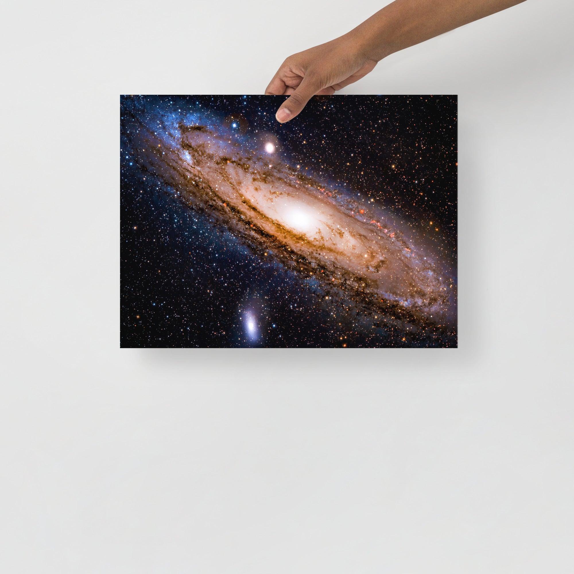 An Andromeda Galaxy poster on a plain backdrop in size 12x16”.