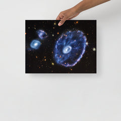 A Cartwheel Galaxy by James Webb Space Telescope poster on a plain backdrop in size 12x16”.