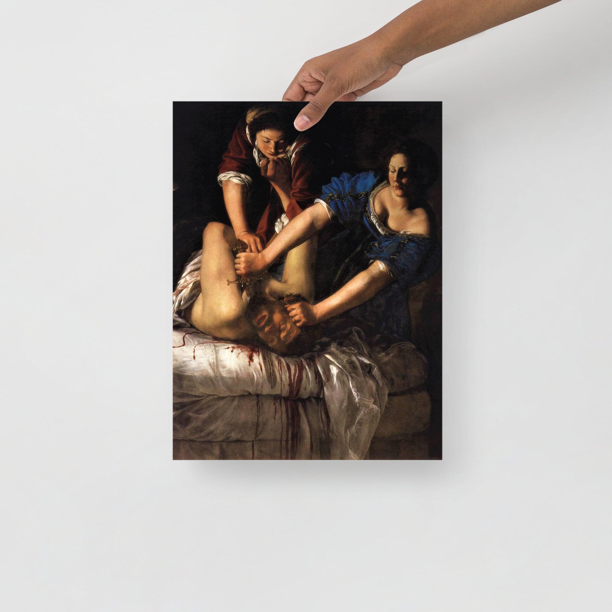 A Judith beheading Holofernes by Artemisia Gentileschi poster on a plain backdrop in size 12x16”.
