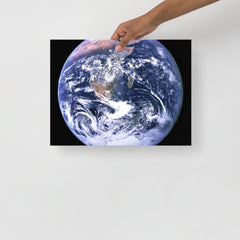 The Blue Marble poster on a plain backdrop in size 12x16”.