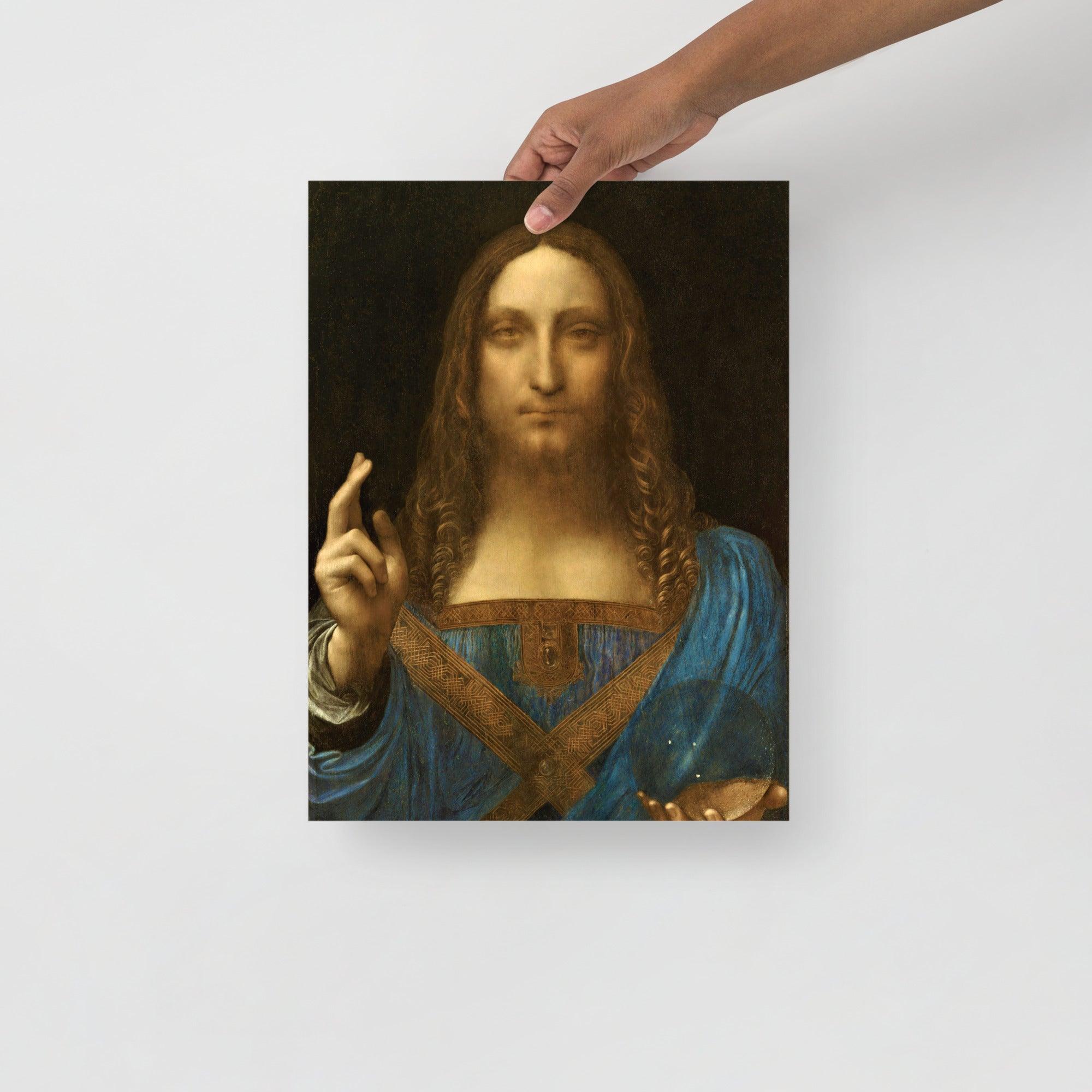 A Salvator Mundi by Leonardo Da Vinci poster on a plain backdrop in size 12x16”.