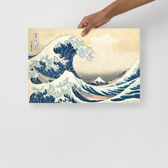 The Great Wave off Kanagawa by Hokusai poster on a plain backdrop in size 12x18”.