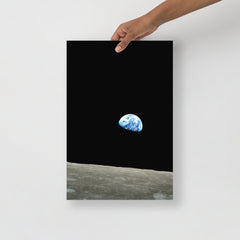 An Earthrise Apollo 8 poster on a plain backdrop in size 12x18”.