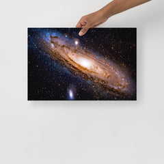 An Andromeda Galaxy poster on a plain backdrop in size 12x18”.