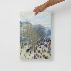 A Boulevard des Capucines by Claude Monet poster on a plain backdrop in size 12x18”.