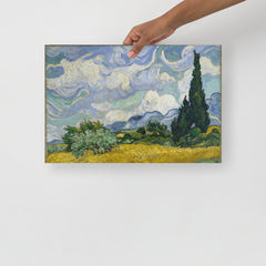 A Wheat Field with Cypresses by Vincent van Gogh poster on a plain backdrop in size 12x18”.