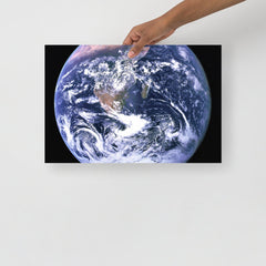 The Blue Marble poster on a plain backdrop in size 12x18”.