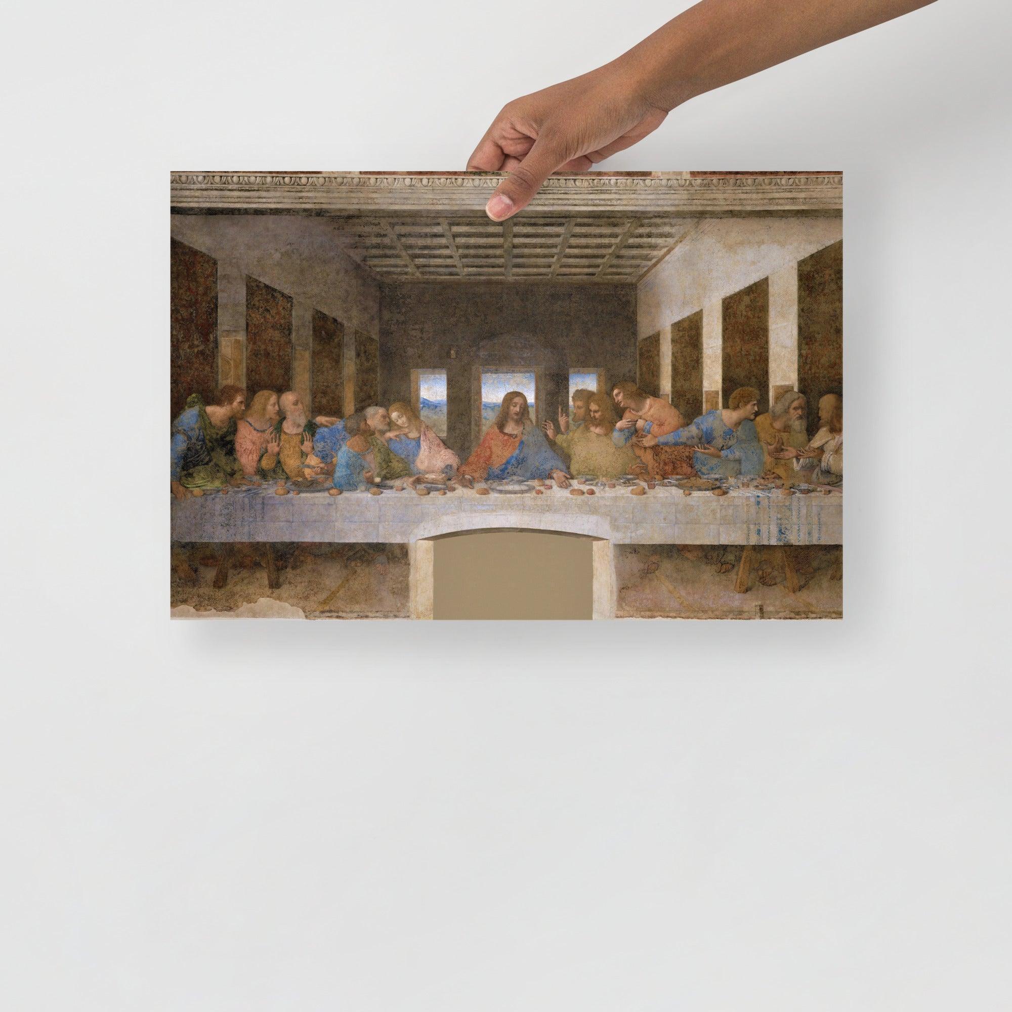 The Last Supper by Leonardo Da Vinci poster on a plain backdrop in size 12x18”.