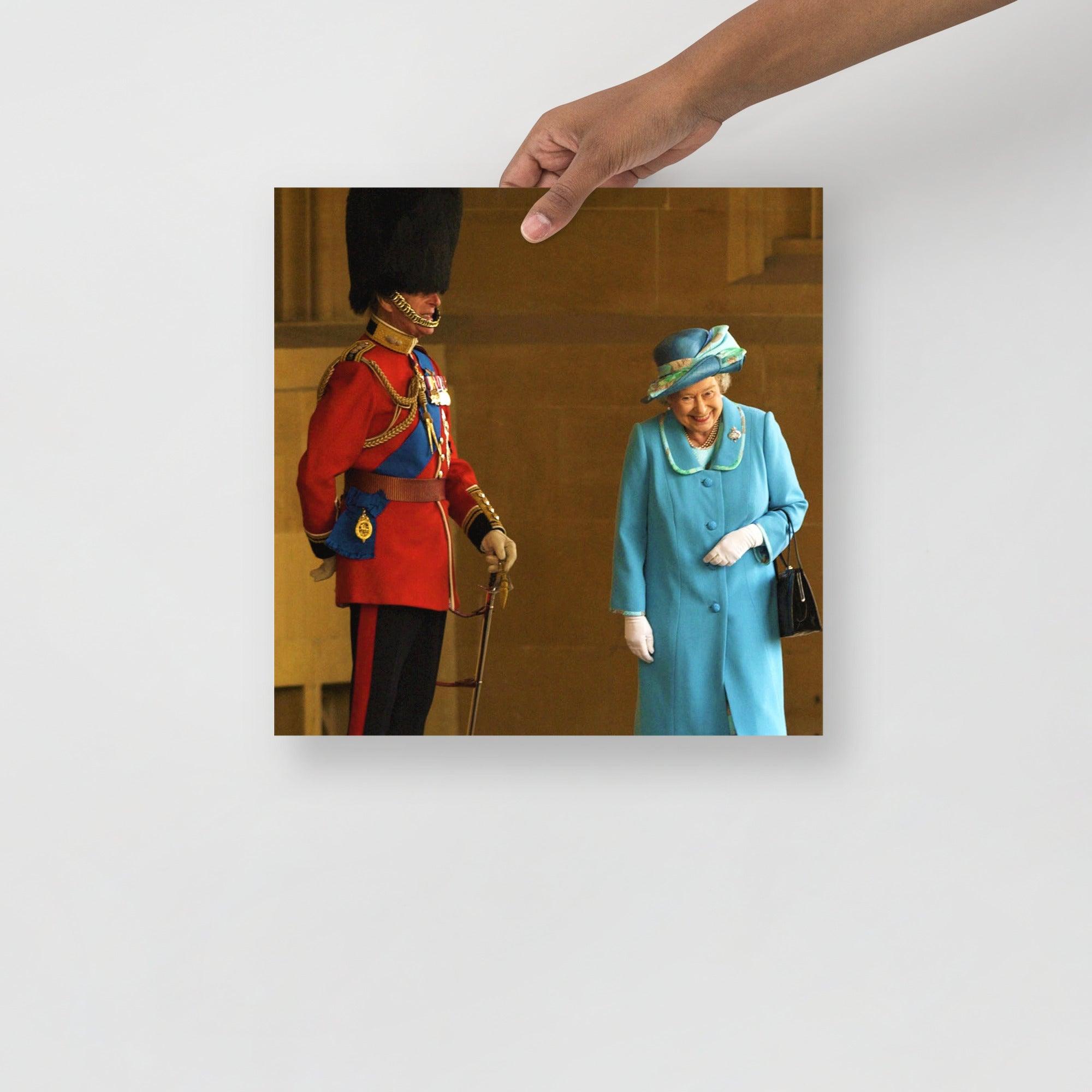 A Queen Elizabeth II with Prince Philip poster on a plain backdrop in size 14x14”.