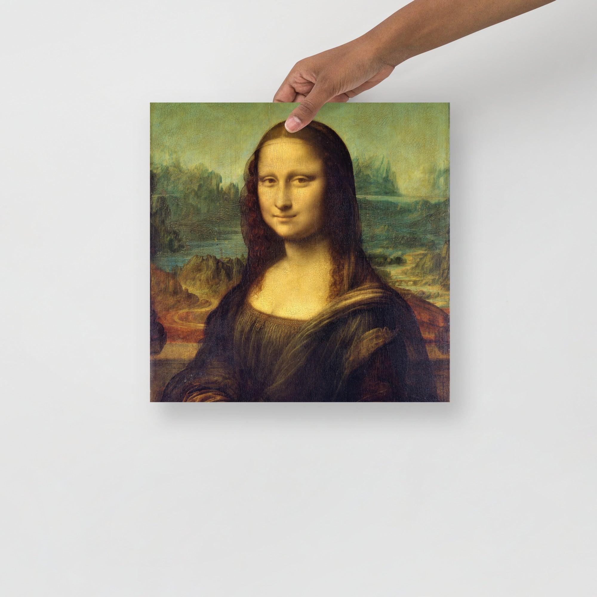 A Mona Lisa by Leonardo Da Vinci poster on a plain backdrop in size 14x14”.