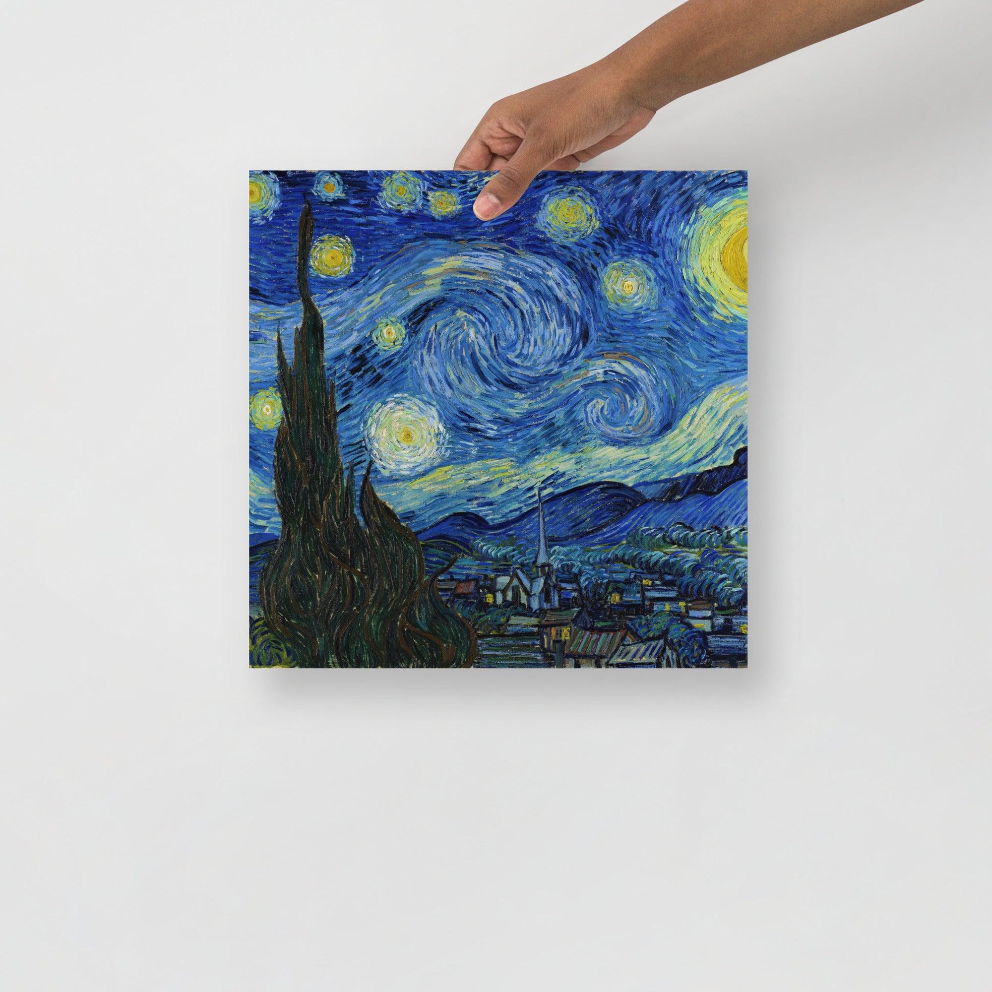 A The Starry Night by Vincent van Gogh poster on a plain backdrop in size 14x14”.