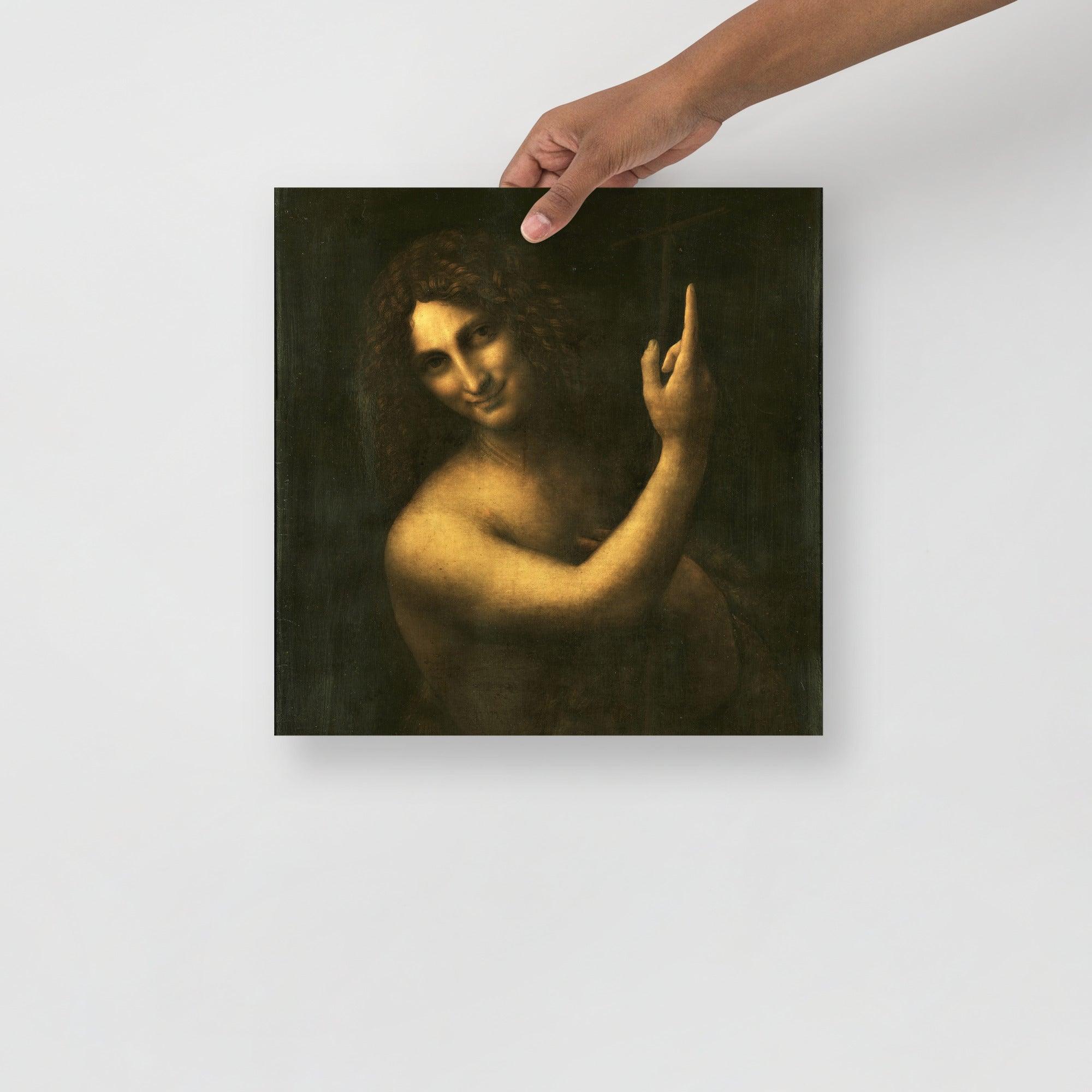 A Saint John the Baptist by Leonardo da Vinci poster on a plain backdrop in size 14x14”.