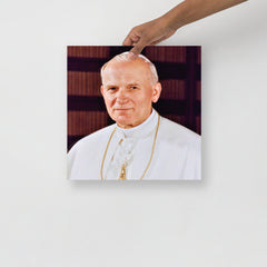 A Pope John Paul II poster on a plain backdrop in size 14x14”.