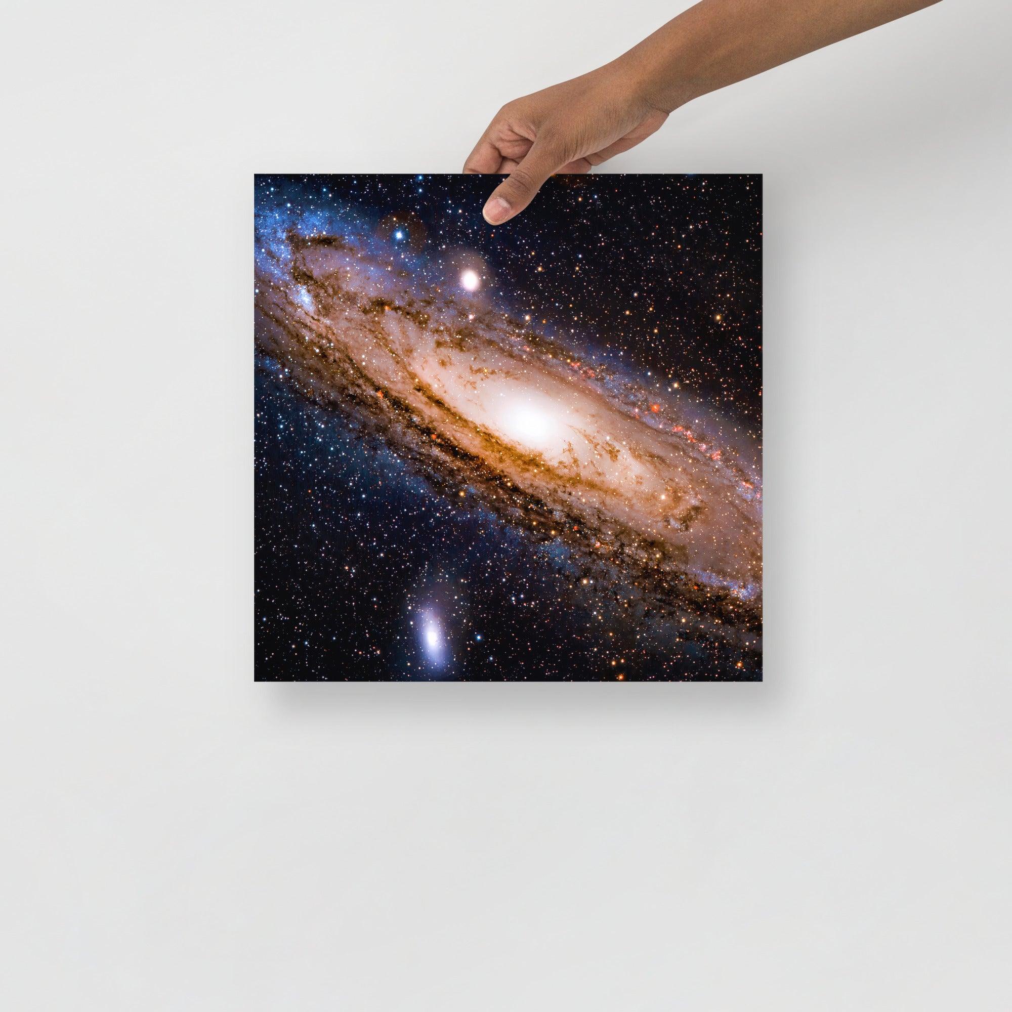 An Andromeda Galaxy poster on a plain backdrop in size 14x14”.