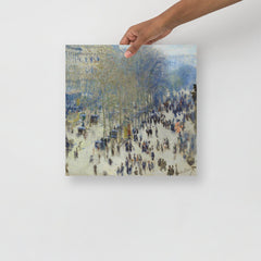 A Boulevard des Capucines by Claude Monet poster on a plain backdrop in size 14x14”.