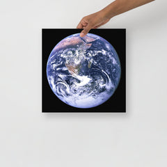 The Blue Marble poster on a plain backdrop in size 14x14”.