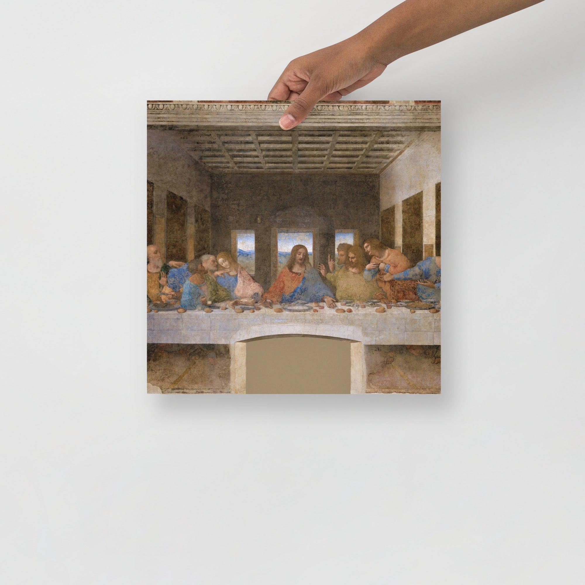 The Last Supper by Leonardo Da Vinci poster on a plain backdrop in size 14x14”.