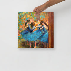 A Dancers in Blue by Edgar Degas poster on a plain backdrop in size 14x14”.