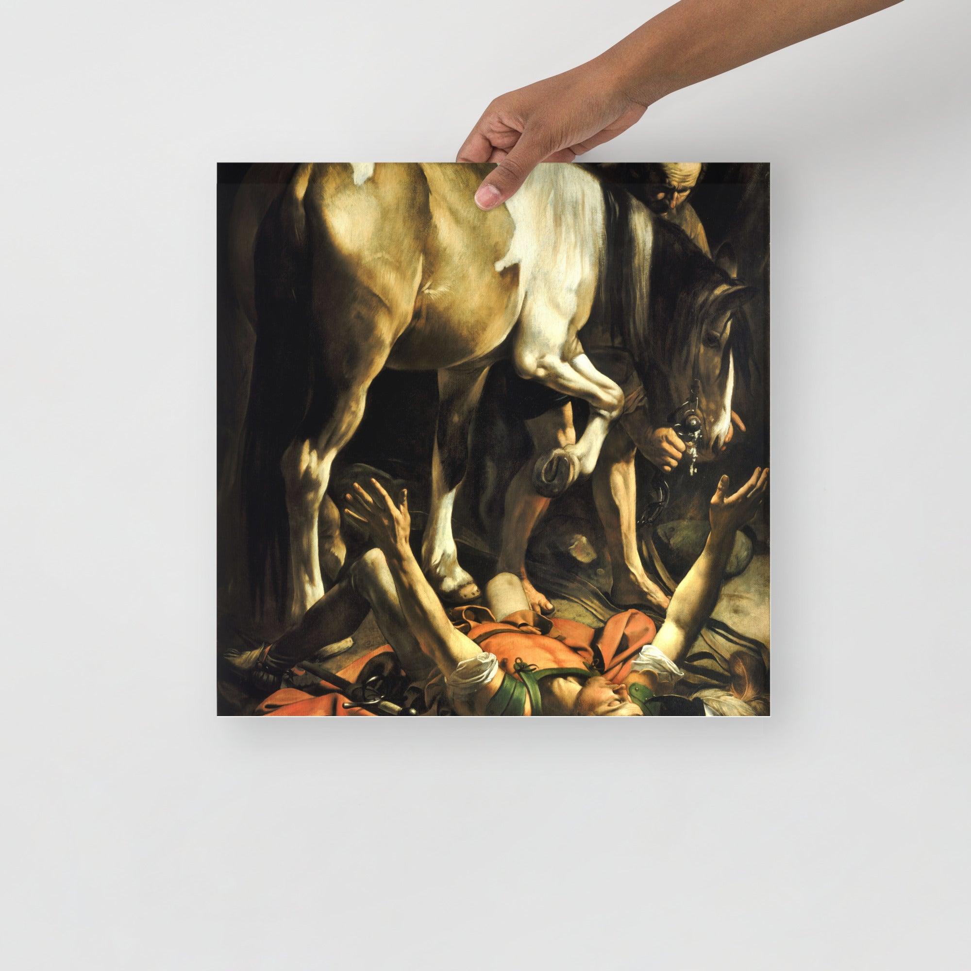 A Conversion on the Way to Damascus by Caravaggio poster on a plain backdrop in size 16x16”.