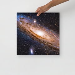An Andromeda Galaxy poster on a plain backdrop in size 16x16”.