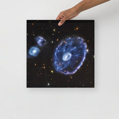 A Cartwheel Galaxy by James Webb Space Telescope poster on a plain backdrop in size 16x16”.